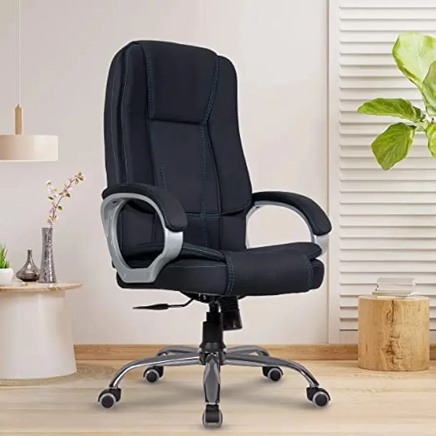 Black high back executive office chair with cushioned upholstery and designer base on white background
