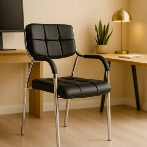Black visitor chair with cushioned seat, padded armrests, and chrome frame on white background